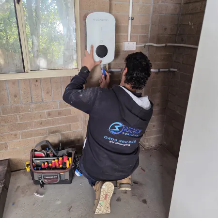Electrician installing Sigenergy EV Charger